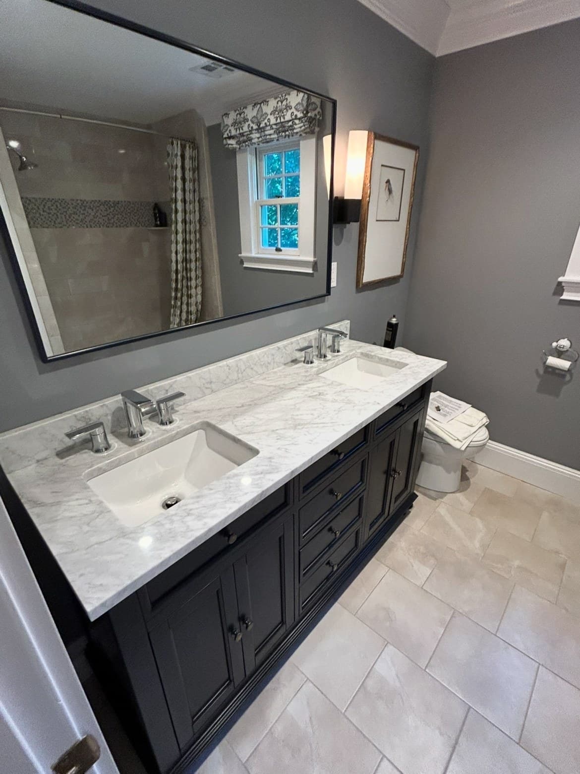 Finished double-vanity bathroom remodel with marble countertop by Lucas Plumbing, MetroWest MA